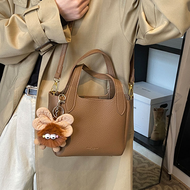 韩国ins潮流时尚水桶包女2025冬季简约百搭单肩包高级感休闲女包,淘宝优惠券,粉丝福利购,淘宝优惠卷