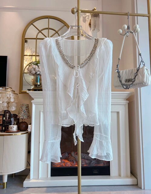 ເດັກຍິງຮ້ອນ ruffled Floral Chiffon Shirt ດ້ານເທິງຂອງແມ່ຍິງອຸດສາຫະກໍາຫນັກສີຂາວເພັດ lace Up ວ່າງກະດິ່ງເສື້ອຢືດ