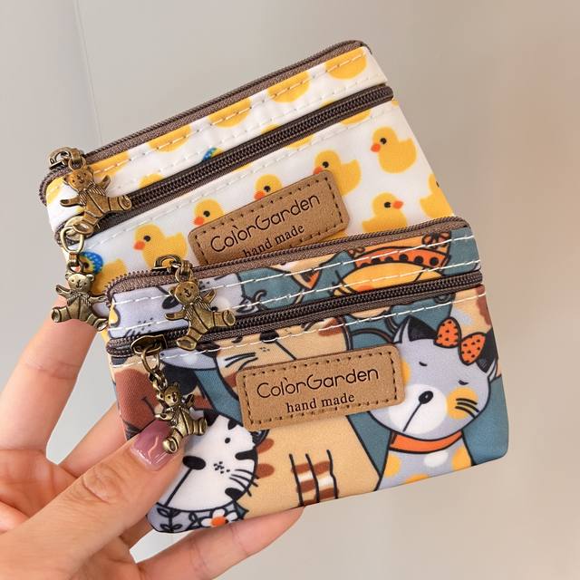 Korean version of the waterproof Oxford cloth cute cartoon printed mini double -layer coin bag card bag coin bag certificate storage bag