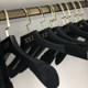Good-looking and practical black solid wood clothes hanger