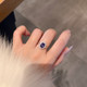 Retro style small carat white sapphire ring