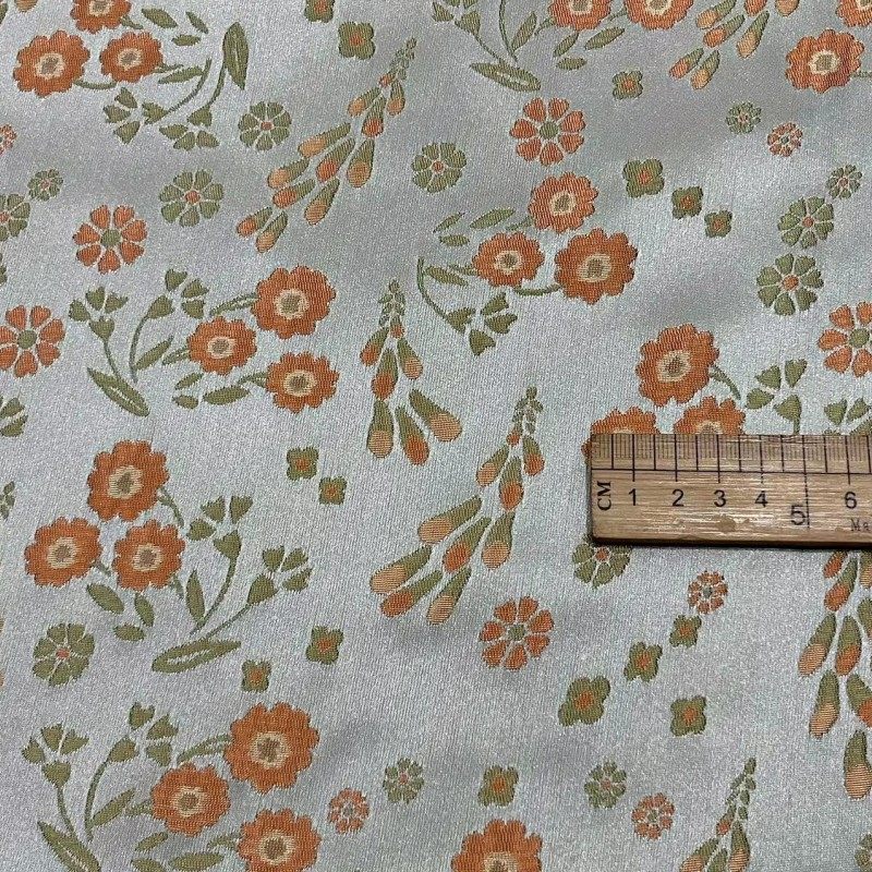 中国风小花朵水草提花面料 微括橘粉色织提花布缎面女装箱包布料,淘宝优惠券,粉丝福利购,淘宝优惠卷