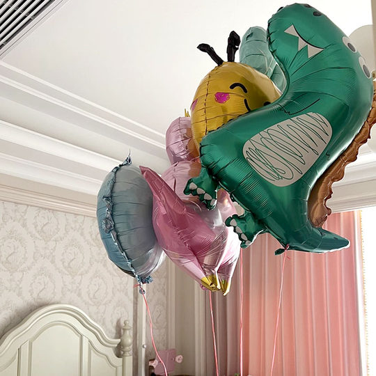 Various styles of helium-filled air balloons