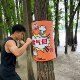 Boxing training target with ring tag tied to tree stump