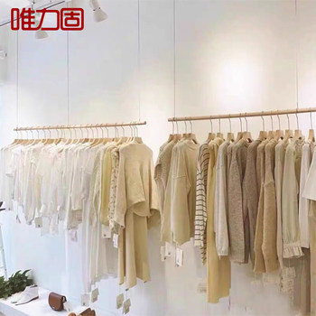 ຮ້ານຂາຍເສື້ອຜ້າເພດານໄມ້ແຂງແບບງ່າຍດາຍ rack hanging clothes rack ຜູ້ຊາຍແລະແມ່ຍິງແບບ Nordic rack ການສະແດງສ້າງສັນ