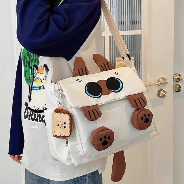 Cute cartoon cat schoolbag female junior high school student niche design small backpack female college student high school student crossbody bag