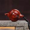 Hand-carved teapot made of rosewood