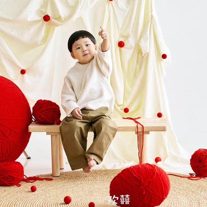 新年儿童拍照道具红毛球米色褶皱背景布红毛线团装饰摆件原麻地毯,淘宝优惠券,粉丝福利购,淘宝优惠卷