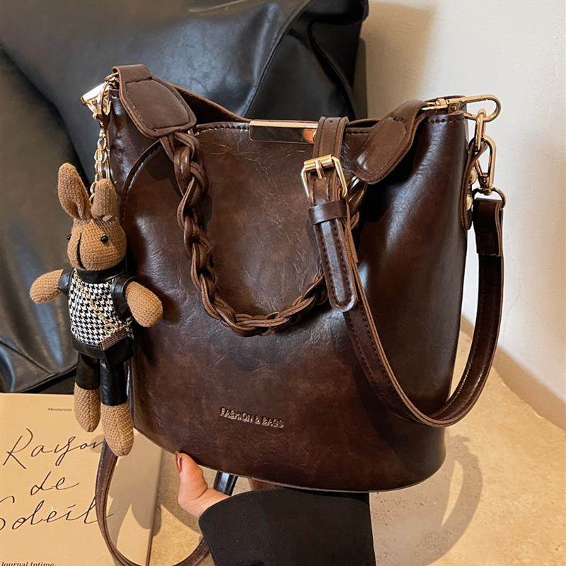 覆古小众水桶包包女士2025新款高级质感百搭斜挎包爆款手提通勤包,淘宝优惠券,粉丝福利购,淘宝优惠卷