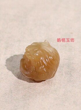 和田玉糖玉醒狮挂件手串配珠鉴定