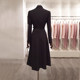 Mid-length, elegant, wide-slung, waist-cinched woolen coat