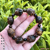 Fidelity Hailiu Wen playing Buddhist beads bracelet