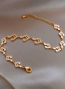 滴油金色镶钻音符创意链条手链时