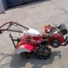 Four-wheel drive direct-connected micro-tiller, hand-held farmland, vegetable garden rotary tiller, vegetable ridger