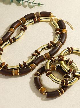 Wooden pendant necklace with multiple strands of acrylic