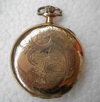 A century-old antique pocket watch with three doors and a gold-plated porcelain plate.
