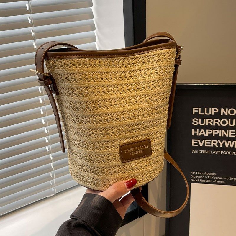 夏天编织草编包包女2025新款海边度假沙滩包百搭小众斜挎包水桶包,淘宝优惠券,粉丝福利购,淘宝优惠卷