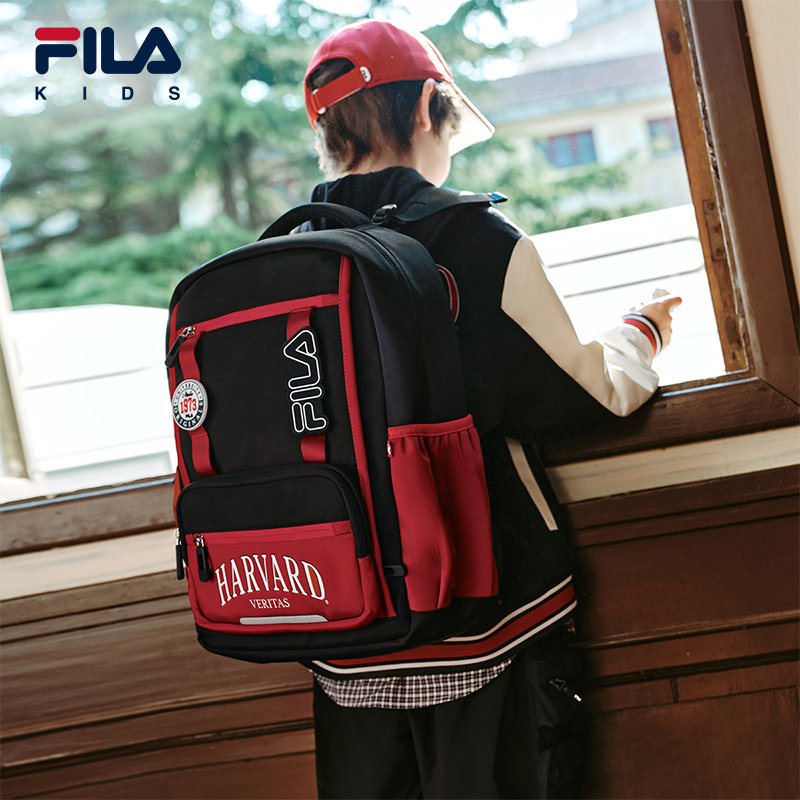 FILA KIDS ДЕТСКИЙ рюкзак FILA 2025 осень, новый стиль для мальчиков и девочек, учащихся начальной школы, уменьшает нагрузку на школьные сумки
