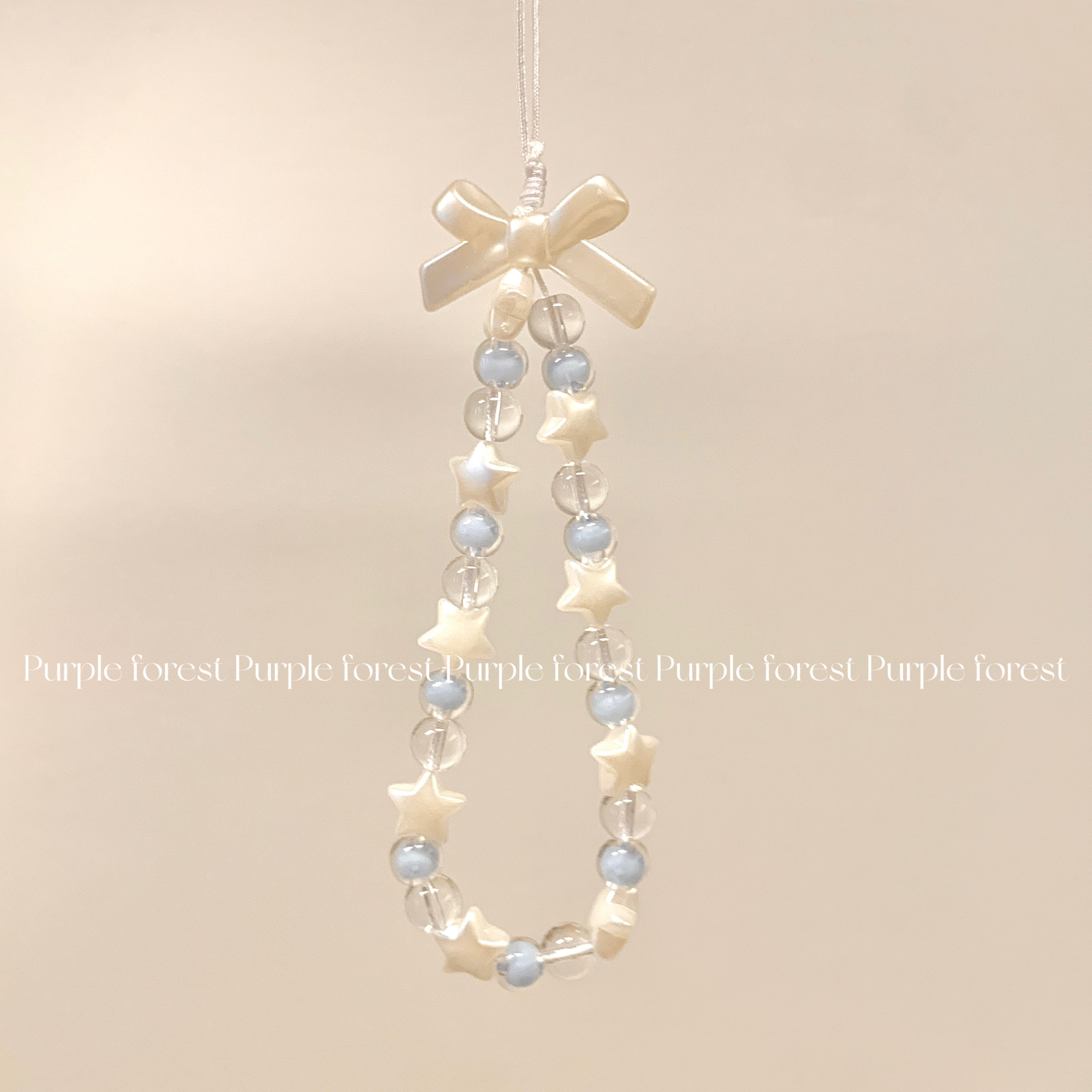 Original design by Purple Forest. Silver-white bow, star, blue bouncing phone charm, CCD instant camera lanyard.
