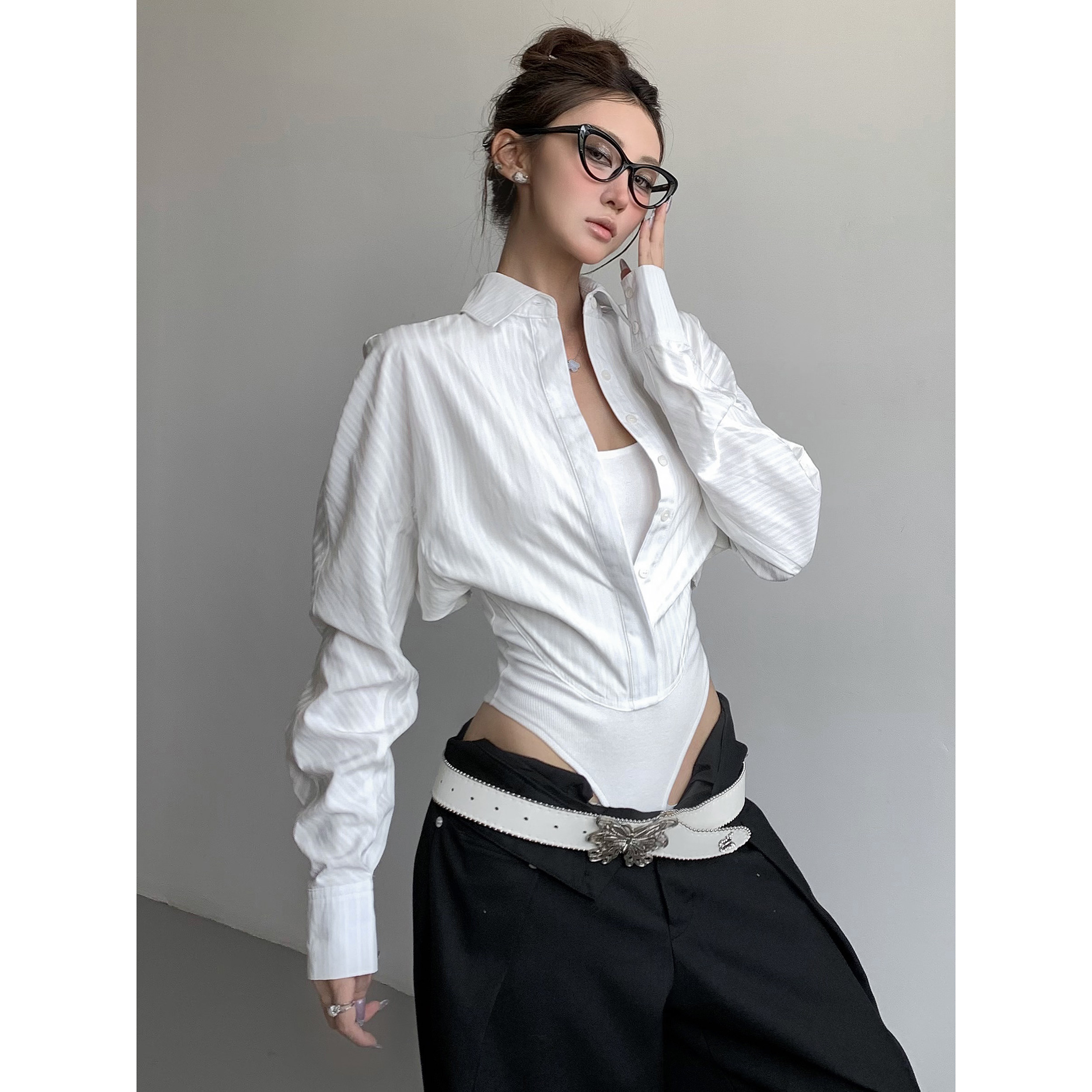 White top with a unique design, a subtle and alluring two-piece long-sleeved shirt/bodysuit, a sexy and fitted blouse.