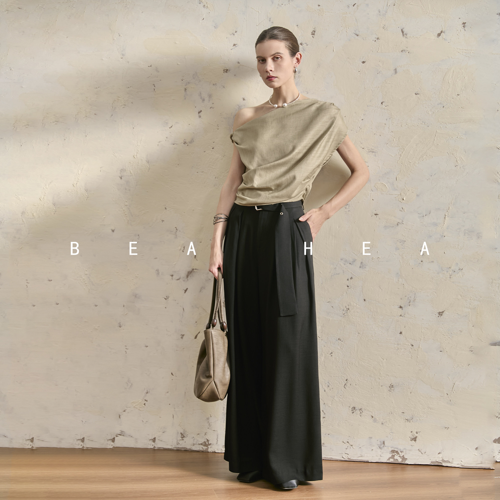 BEA HEA's trendy retro-inspired deconstructed asymmetrical off-shoulder T-shirt design offers a cool and relaxed feel for summer 2026.
