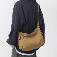 Single shoulder bag for men and Japanese in 2024, new casual canvas crossbody bag, ins shoulder bag, student backpack, mailman bag, shoulder strap