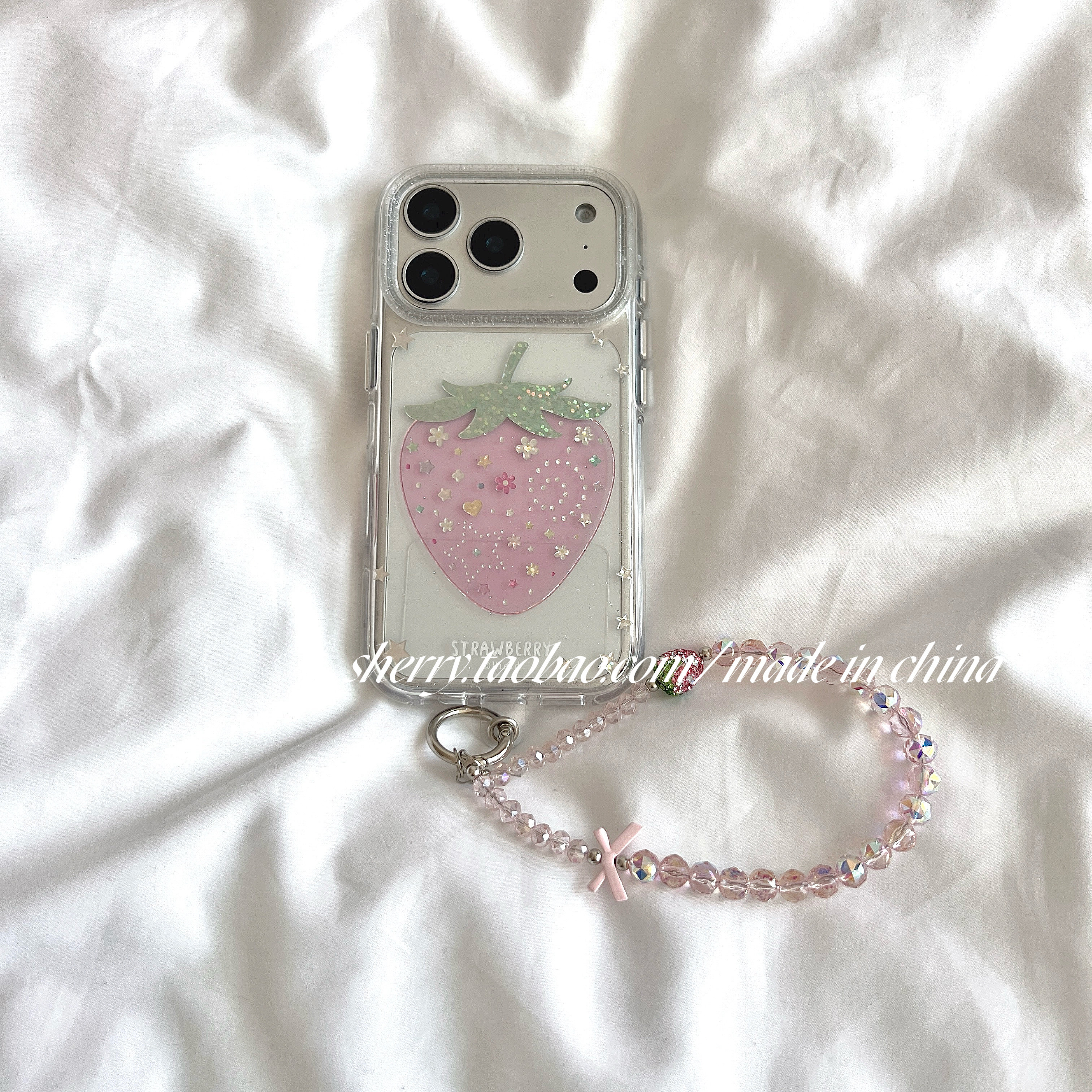 SHERRY*ins-style sheer, shimmering pink rhinestone strawberry case for Apple iPhone 17 Pro Max and iPhone 16 Pro. A unique, girly, minimalist, and refreshingly gentle design.