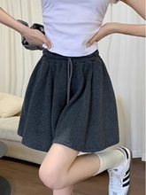 Grey sports shorts with a drooping ballet style high waisted skirt pants