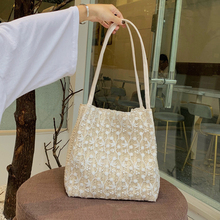 Fairy handbag 2021 Korean version new fashionable lace shoulder bag woven bucket bag versatile grass woven small bag