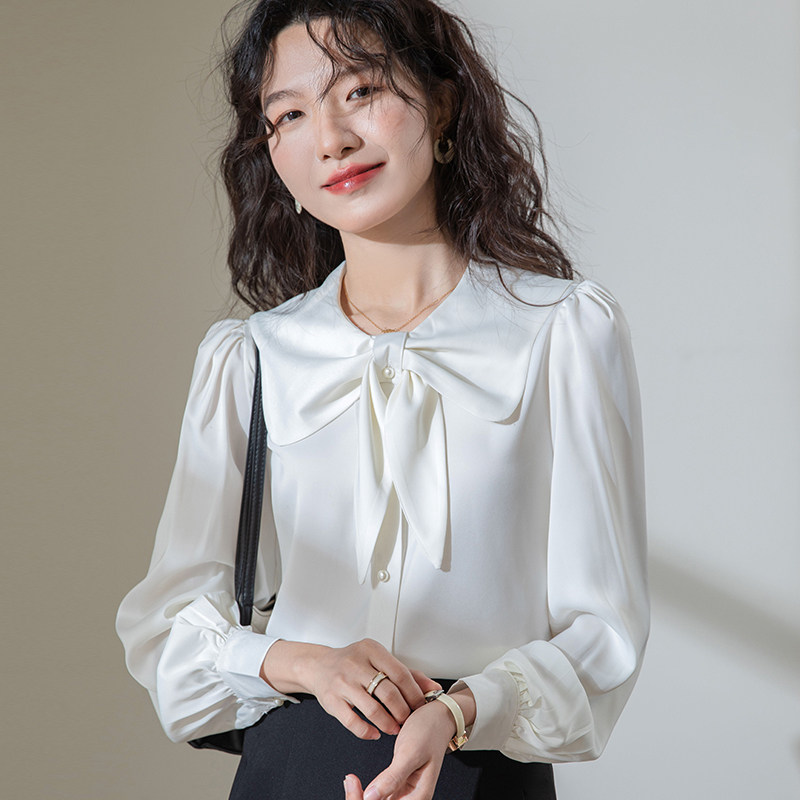 French-style Peter Pan collar bow-tie satin white blouse for women, 2026 spring and autumn new style, commuter professional inner layer top.