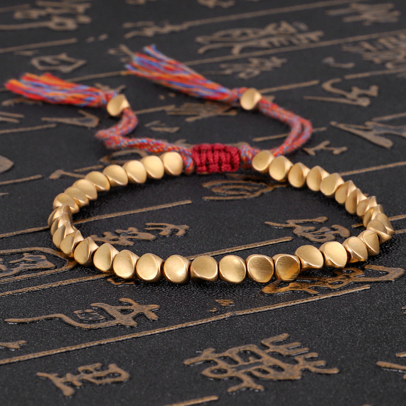 Cross-border new jewelry hand-woven text play line bracelet shaped copper bead bracelet creative pull tassel hand rope