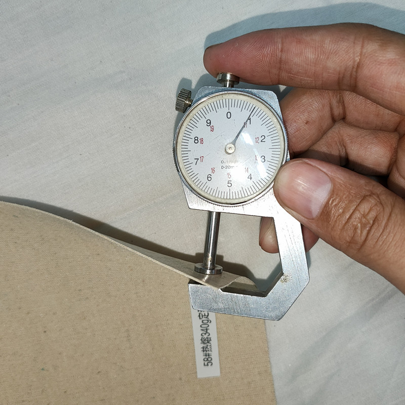 Self-adhesive hot-pressing styling cloth stiff lining cloth self-adhesive hot-melt adhesive styling cloth for shoes Guangzhou factory supply