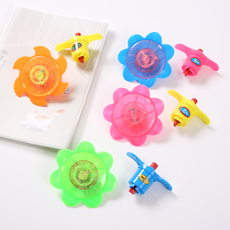 Luminous rotating top creative cartoon flash chain toy colorful catapult small top student gift