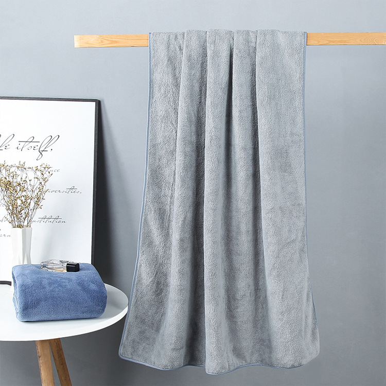 Factory wholesale 90*160 extra large thick coral fleece absorbent household large bath towel can be worn wrap towel towel can be sent on behalf