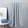Factory wholesale 90*160 extra large thick coral fleece absorbent household large bath towel can be worn wrap towel towel can be sent on behalf