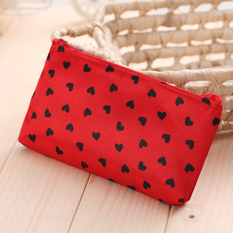 Cosmetic bag small Korean version of cosmetics storage bag love cosmetic bag Taobao gifts hand bag satin small bag wholesale