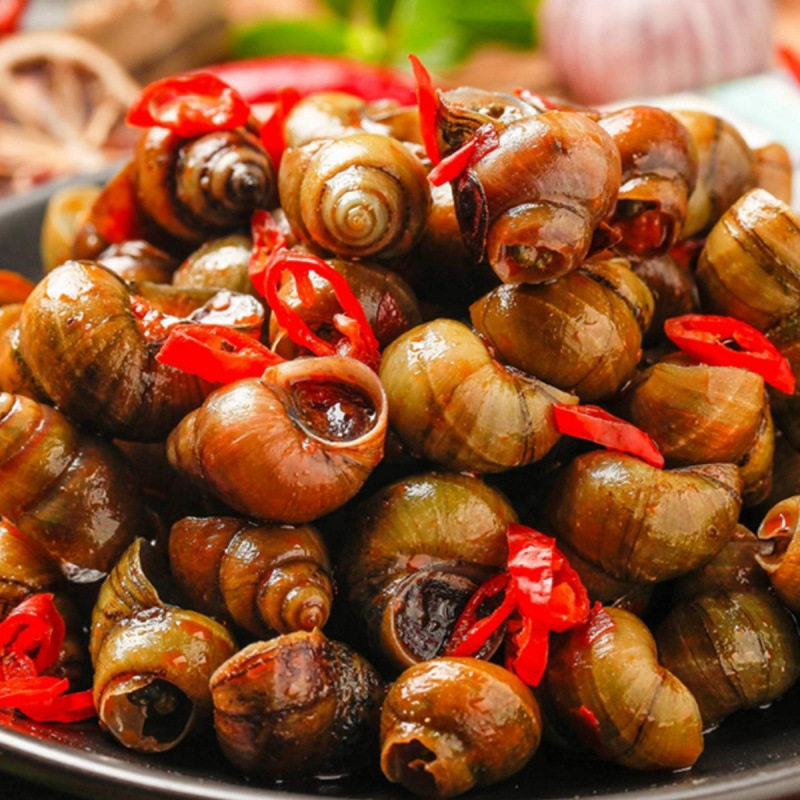 Spicy and Delicious Cooked and Frozen Snails as a Snack to Accompany Drinks