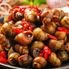 Spicy and Delicious Cooked and Frozen Snails as a Snack to Accompany Drinks