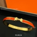 Gold orange enamel bracelet
