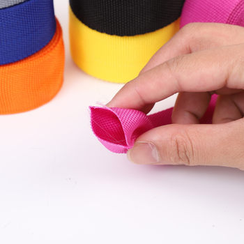 Polypropylene hollow ribbon bag accessories hollow color empty tube 600DPP with polyester network silk schoolbag portable belt