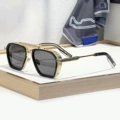 Gold and black frame, black lens
