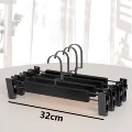 Black trouser rack with black clip and black flat hook