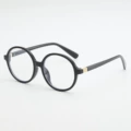 Black frame, white lens