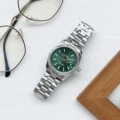 Silver shell green surface