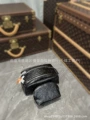 Black embossed cosmetic bag