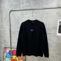 Black sweatshirt with a triangular round neck in the middle