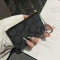 "black ""coach"" coin zipper bag"