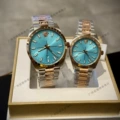 Sky blue dial with rose gold accents - left male, right female