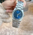 Old watch with silver blue glossy surface