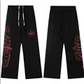 Black pants with red graphic